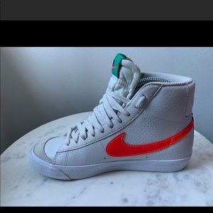 Nike mid Blazer 77 white with orange and green detail. Boys size 5.5